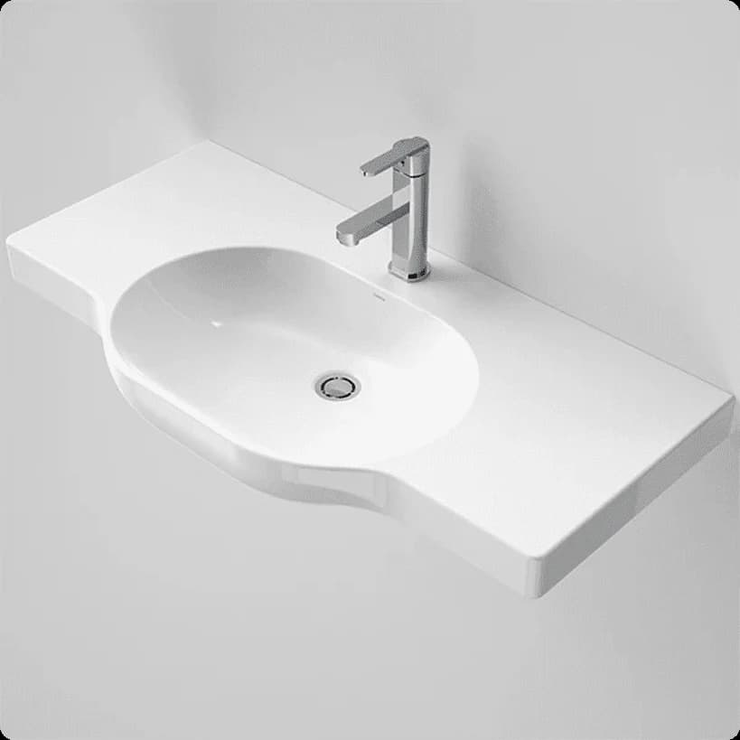 A wide white wheelchair-accessible wall-hung basin with a centre bowl