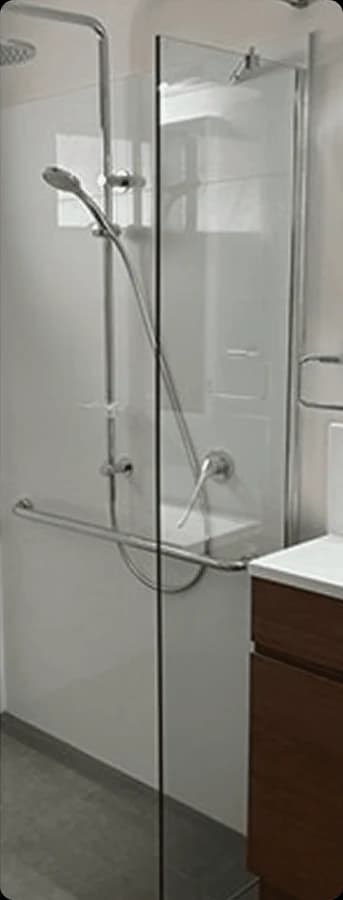 A frameless glass shower panel