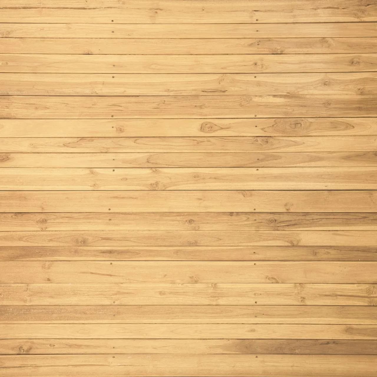 Light oak timber floorboards with a pale honey finish and straight grain